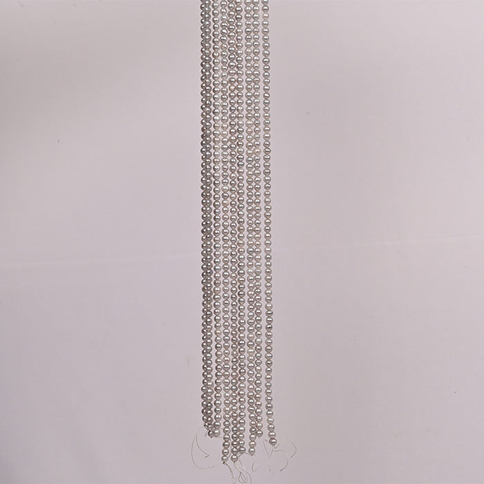 Natural fresh water pearls (Moti), round silver colour — close-up